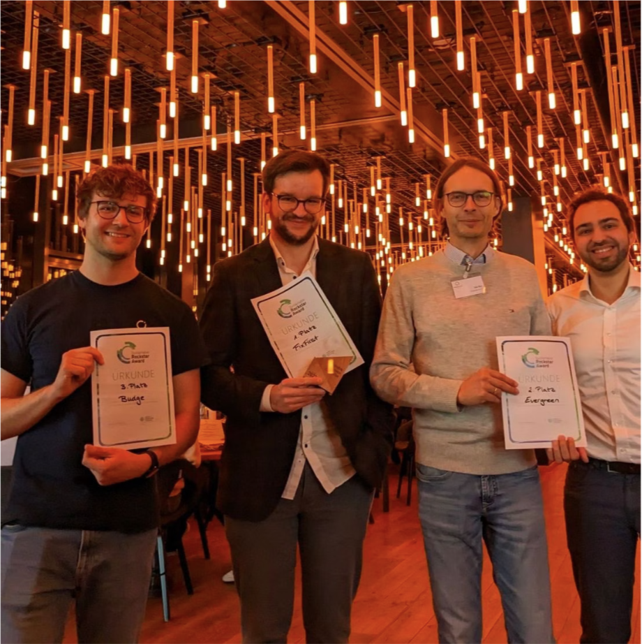 FixFirst team holding their Sustainable Rockstar Award certificate
